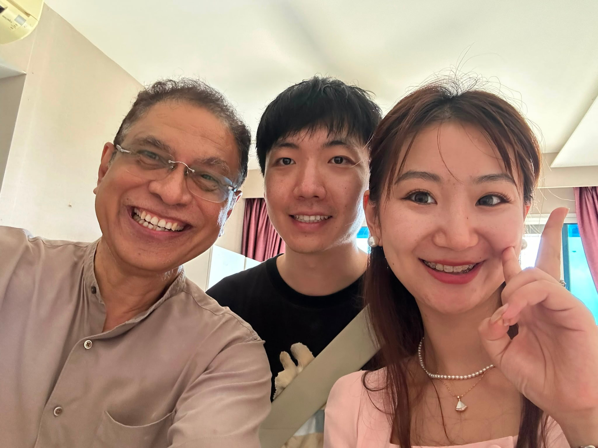 Chan with happy clients after closing a deal